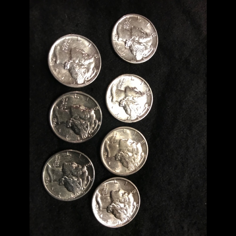 Seven High Grade Brilliant Uncirculated Mercury’s
